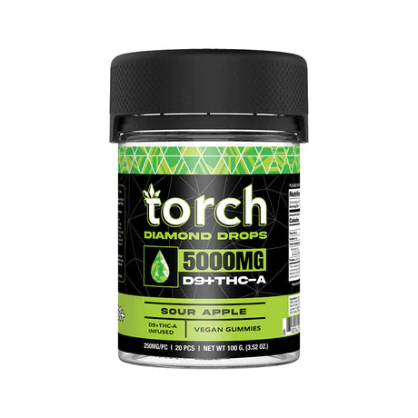 A container labeled "Torch Diamond Drop Gummies | 5000mg" with a sour apple flavor. The green and black design showcases the Torch gummies. Net weight: 100g.