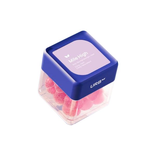 A transparent plastic container with a blue lid contains pink gummies labeled "Urb Mile High Skybites Gummies," with the additional text "Vegan Gummies, 50mg Nano Delta-9 THC per Gummy, 10 Gummies Per Container.