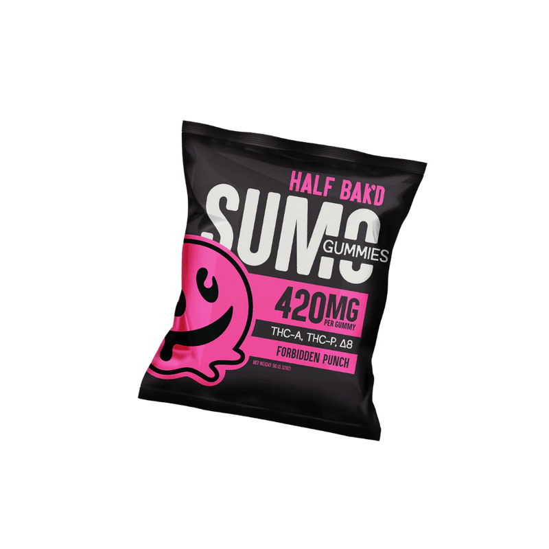 A black bag of Half Bak'd Sumo Gummies 420mg | 2ct labeled "Half Bak'd" contains a 420mg cannabinoids blend of THC-A, THC-P, and Delta-8, in the tantalizing Forbidden Punch flavor. The packaging also showcases a playful pink illustration of a face.