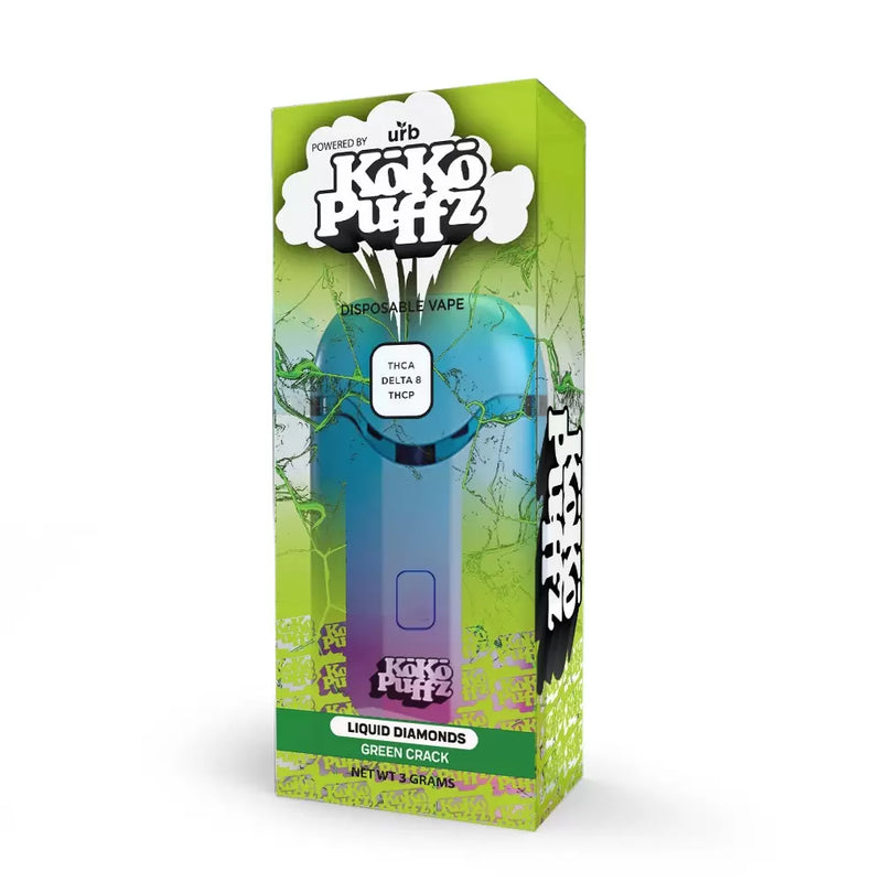 A box of Urb Koko Puffz Liquid Diamonds Disposable Vape with THC-A Liquid Diamonds, Green Crack flavor. The green and purple packaging showcases the brand name and specifications clearly.