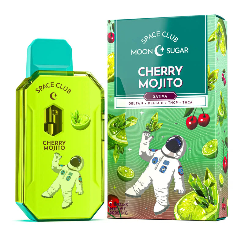 Image of a product packaging for Space Gods Space Club Disposable Vape Moon Sugar | 3g. It features a green vape device, part of the Moon Sugar Disposables line, next to its box, both adorned with an astronaut illustration and images of cherries and mint leaves.