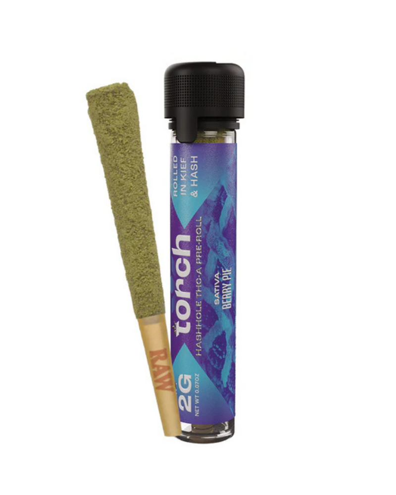 A premium Torch Hashhole THCA Pre-Roll, weighing 2g and wrapped in a green leaf, is placed beside a transparent tube labeled "Torch" with the flavor "Berry Pie" and highlighting the unique quality of THC-A pre-rolls.