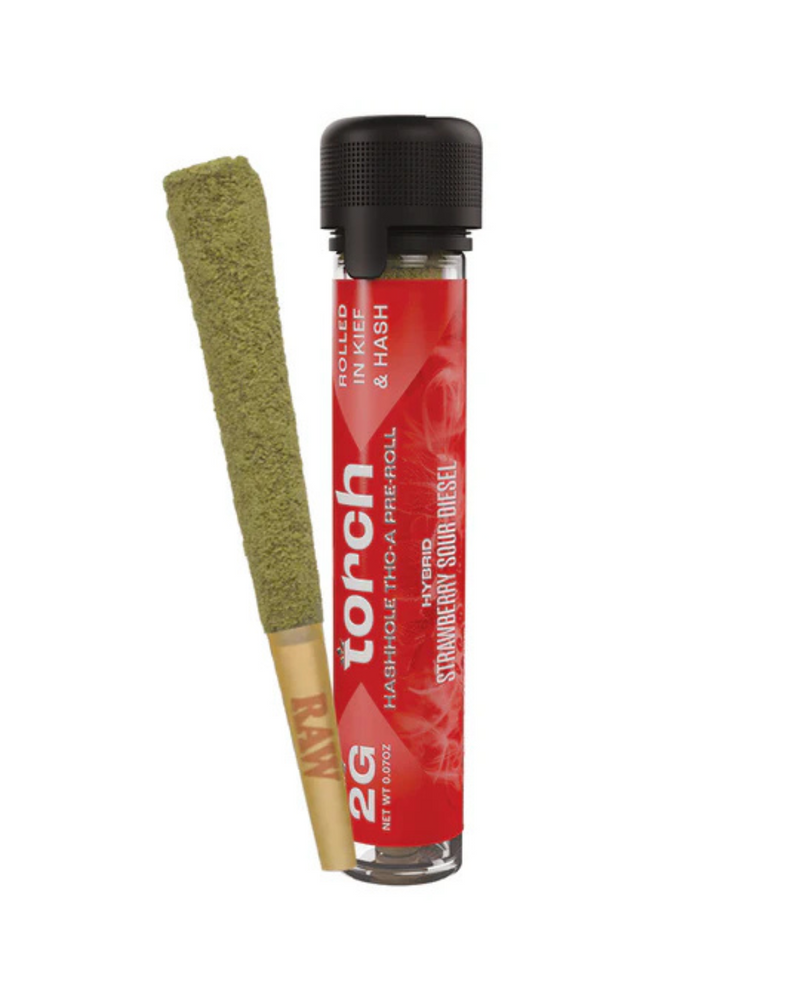 A high-end cannabis product includes a green rolled exterior next to a red cylindrical container labeled "Torch" with the flavor "Strawberry Sour Diesel." This showcases the Torch Hashhole THCA Pre-Roll, weighing 2g, which is meticulously hand-dipped in hash for an enhanced experience.