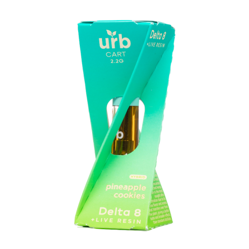 A turquoise and green triangular box labeled "Urb" contains an Urb Delta 8 Live Resin Cartridge | 2.2g in the flavor "pineapple cookies." The visible vape cart, known for its high-quality hemp, is partially wrapped by the box's unique design.