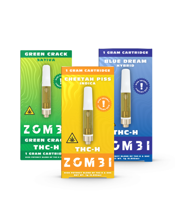 Three Zombi THC-H Vape Cartridge 1g boxes: Green Crack (green, sativa), Cheetah Piss (orange, indica), and Blue Dream (blue, hybrid). Each features a cartridge image with distinct THC-H branding.