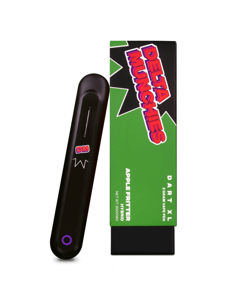 A black vape pen labeled "DM," placed beside a green and black box with the red text "Delta Munchies." The box is marked with "Dart XL," "Apple Fritter," and describes it as a "2.2ML Delta 8 Disposable Vape Pen" made from Premium Quality American Hemp, boasting an Automatic Draw for easy use.