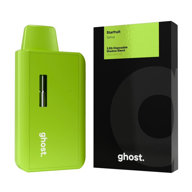 A green disposable vape pen is displayed next to a black and green package labeled "Starfruit Sativa Ghost Shadow Blend Disposable | 3.5g by Ghost".